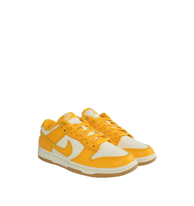 Image 2 of 5 - YELLOW - NIKE Dunk Low Retro Basketball Sneaker featuring lace-up style, removable insole, leather and textile upper, synthetic lining and rubber sole.  