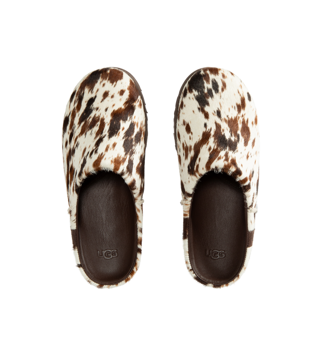 Image 4 of 4 - BROWN - Ugg Men's Otzo Western Clog is crafted with a hand-painted cow hair upper and reimagines the brands signature clog silhouette through a Western-inspired lens. Designed for all-day comfort, this distinctive style features a leather and RWS wool jersey lining enhanced with a peppermint-based anti-odor treatment, along with a contoured EVA footbed for cushioning and support. A leather and microfiber sockliner provides additional comfort, while the lightweight rubber outsole with 30% FCS- 