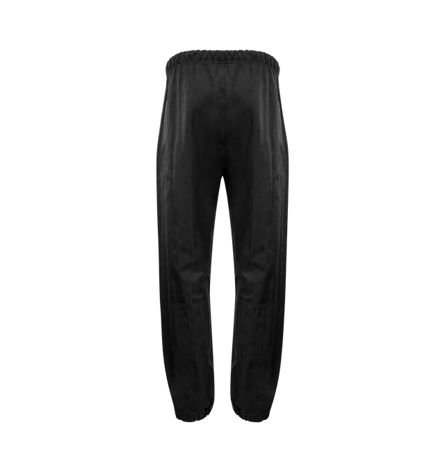 Image 2 of 3 - BLACK - Fear of God Drawstring Military Trackpants have an elastic drawstring waist, two side pockets, gathered ankles, and a leather log patch. 100% polyester. Made in Italy.  