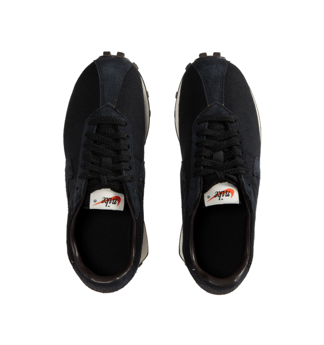 Image 5 of 5 - BLACK - Nike LD-1000 Retro Running Shoe reissued with its iconic flared heel. This edition of the heritage classic returns in minimalist black upper with white outsole. Real and synthetic leather merge with airy textiles and the iconic Waffle sole. 