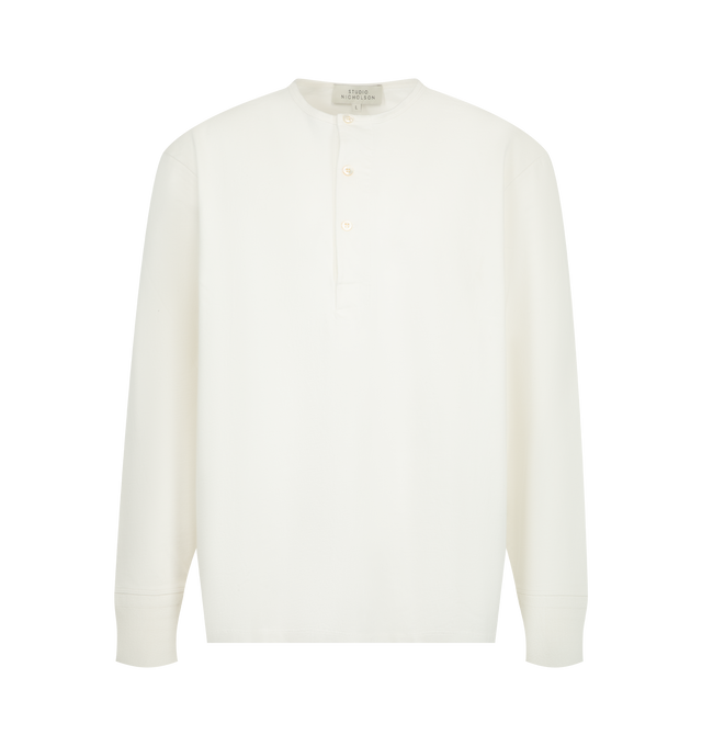 Image 1 of 2 - WHITE - Studio Nicholson Kuyto Long Sleeve Jersey is crafted from soft-touch cotton jersey and features a refined Henley-inspired silhouette designed for effortless layering. An elevated take on a wardrobe staple, it is detailed with a grandad collar, three-button placket, dropped shoulders, and ribbed cuffs, while the specially treated fabric offers a rich peach-like texture and substantial hand feel. Main Material: 100% Cotton. Made in Portugal. 