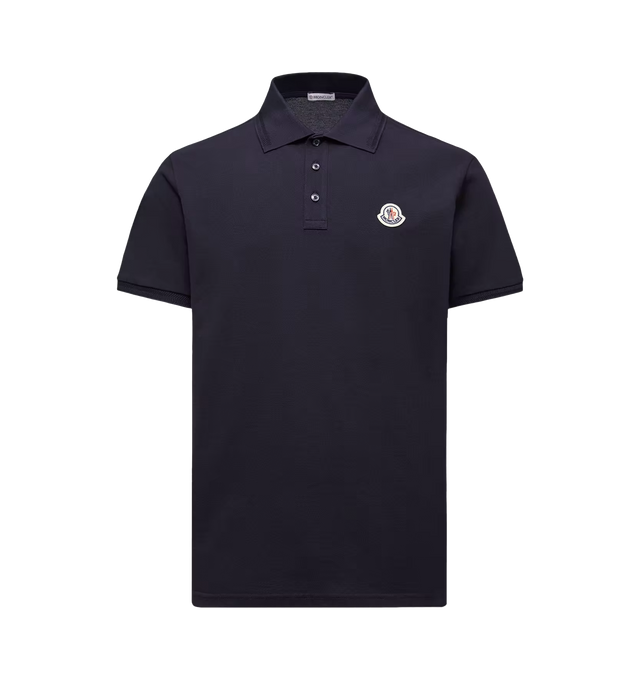 Image 1 of 1 - BLUE - Moncler Mens Cotton Polo Shirt is crafted from cotton piqu. Features a regular fit, ribbed collar with mother-of-pearl button closure, short sleeves, and signature logo patch. Main Material: 100% Cotton; Ribbed Cuffs: 99% Cotton, 1% Elastane/Spandex; Ribbed Collar: 99% Cotton, 1% Elastane/Spandex. Made in Turkey. 