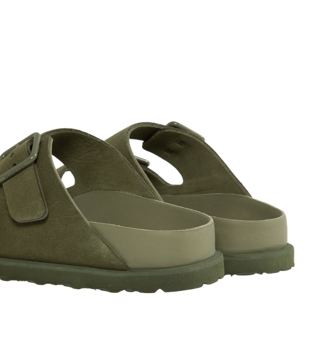 Image 3 of 4 - GREEN - Birkenstock's Arizona sandals in a narrow width. The iconic Arizona sillhouette is  updated in suede featuring adjustable straps with buckle closures, logo details, shaped insole, and EVA outsole. Upper: Luxurious fine flesh out suede, a full grain leather that has been flipped to use the fuzzy side. Footbed: Anatomical shaped BIRKENSTOCK cork-latex footbed, covered with premium, color-matching smooth nappa leather. Sole: EVA outsole with a 3mm EVA welt updates the standard die-cut ou 