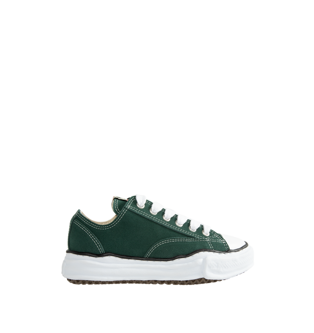 Image 1 of 5 - GREEN - Maison Mihara Yasuhiro Peterson Original Sole Suede Low-Top Sneakers are crafted from cow leather and feature the brand's signature hand-sculpted original sole, modeled in clay by designer Mihara. Designed with the classic Peterson silhouette, this low-top sneaker combines a premium leather upper with the label's distinctive artisanal sole construction. Main Material: Upper: Suede Leather. Sole: Rubber. 