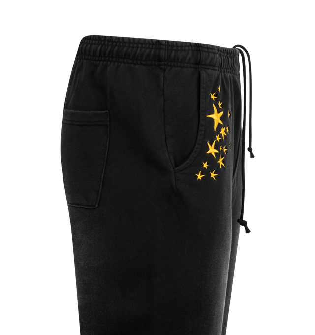 Image 3 of 3 - BLACK - MARKET Galaxy Arc Open Bottom Sweatpants featuring faded wash, elastic waistband with internal drawstrings, side-entry pockets, rear patch pocket and embroidered details. 100% cotton. 