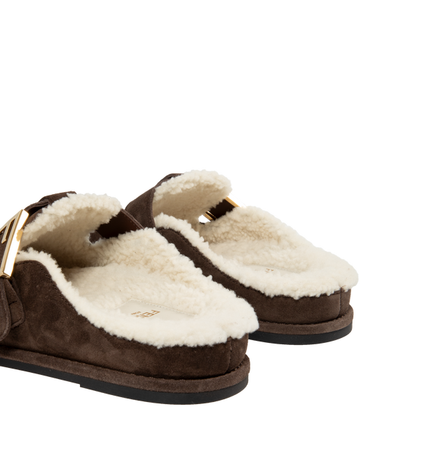 Image 3 of 4 - BROWN - FENDI Feel Mules featuring round-toed sabots with FF strap, suede, finished with white sheepskin interior and gold-finish metalware. Made in Italy. 