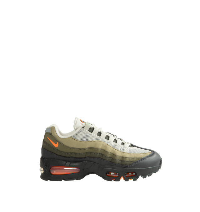Image 1 of 5 - GREEN - Nike Men's Air Max 95 Big Bubble Casual Shoes revive the iconic 1995 silhouette with a construction restored to original specifications. Inspired by human anatomy, the layered upper combines mesh and leather panels for a balance of breathability, comfort, and structure, while reflective details enhance visibility and signature style. An enlarged heel Air unit pairs with visible forefoot Air cushioning for plush comfort and authentic OG appeal. Flex grooves in the sole promote a natura 