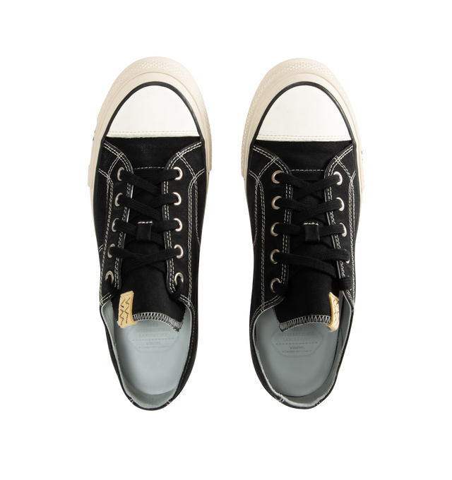 Image 5 of 5 - BLACK - VISVIM Skagway L.T. Lo Leather-Trimmed Canvas Sneakers featuring lace-up, hard-wearing canvas, leather trims, high logo-printed foxing and Vibram rubber soles. 