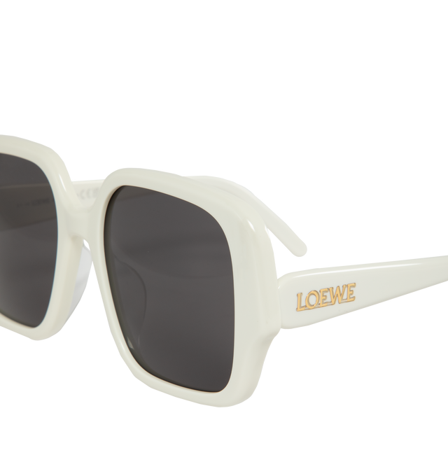 Image 2 of 3 - WHITE - LOEWE Square Slim Sunglasses featuring square-shaped frame in a slim acetate construction with LOEWE in a gold finish on the temple. 100% UVA/UVB protection. 