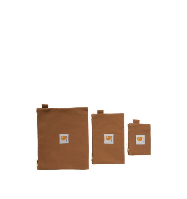 Image 2 of 3 - BROWN - CARHARTT WIP Canvas Pouch Set comprised of three pouches in different sizes, constructed from lined cotton Dearborn Canvas with a waxed finish, zip closure and a woven Square Label appears on each piece. Pouch 1: 10.2 x 8.3 inch. Pouch 2: 8.3 x 5.1 inch. Pouch 3: 5.1 x 3.5 inch. 100% cotton (Dearborn Canvas). 