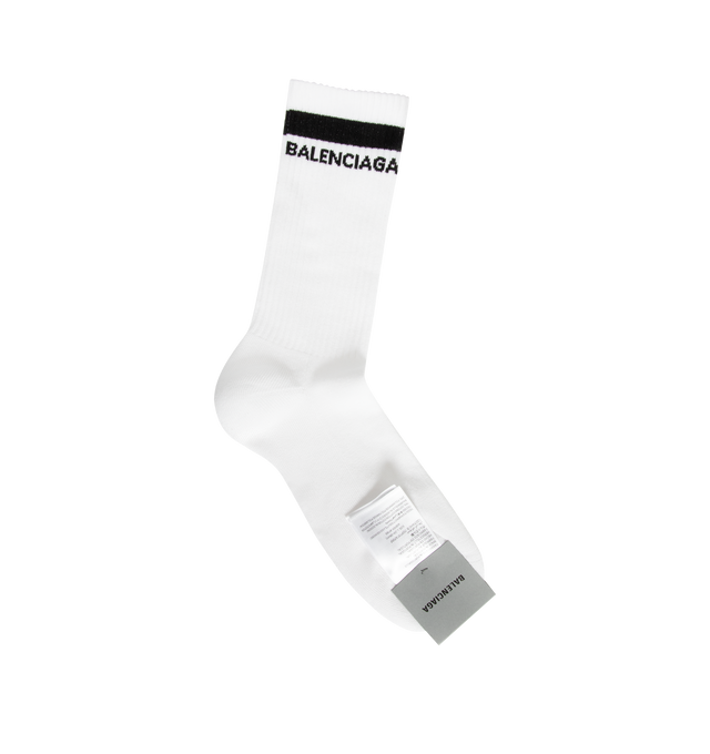 Image 1 of 2 - WHITE - Balenciaga Mens Logo Socks are crafted from a breathable cotton blend. Feature a high-length silhouette, ribbed cuffs, and jacquard logo detailing at the ankle. Main Material: 75% Cotton, 23% Polyamide, 2% Elastane. Made in Portugal. 