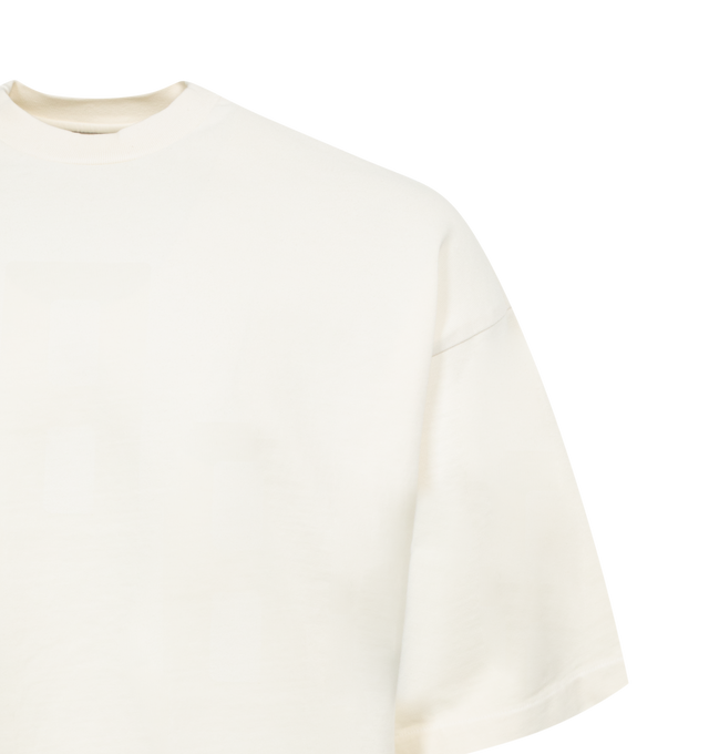 Image 2 of 2 - WHITE - FEAR OF GOD Airbrush 8 T-Shirt featuring heavyweight garment-washed cotton, rib knit crewneck, faded text at chest, dropped shoulders and leather logo patch at back collar. 100% cotton. Made in United States. 