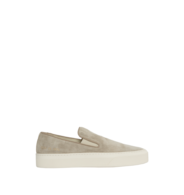 Image 1 of 5 - NEUTRAL - Common Projects minimalist slip-on sneaker crafted from calf suede in a sleek, round-toe profile with thick rubber soles detailed at the heels with signature gold serial number stamp. Made in Italy. 
