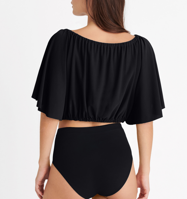 Image 5 of 5 - BLACK - ERES Solal Crop Top featuring elasticated neckline and waist with short butterfly sleeves. 94% Polyamid, 6% Spandex. Made in France. 