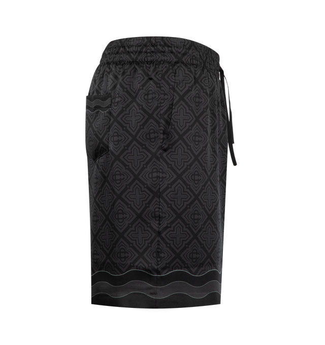 Image 3 of 3 - BLACK - Casablanca Men's Silk Shorts are crafted from luxurious silk and feature a relaxed silhouette with an elasticated drawstring waistband and side pockets for effortless comfort. These designer shorts combine exceptional craftsmanship with Casablanca's signature luxury resort aesthetic, offering a lightweight feel and fluid drape for elevated warm-weather styling. Main Material: 100% Silk. 