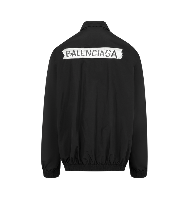 Image 2 of 3 - BLACK - BALENCIAGA Masking Tape Tracksuit Jacket Medium Fit in black techno cotton poplin featuring techno cotton poplin, double-ended zip fastening, long sleeves, 2 zipped slash pockets, gathered at cuffs and waistline and masking tape artwork at chest and back. 50% cotton, 50% polyamide. Lining: 100% polyester. Made in Italy. 