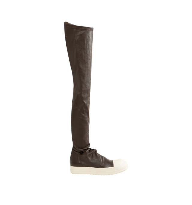 Image 2 of 5 - BROWN - Rick Owens Women's High Stocking Sneakers are crafted from stretch lamb leather and feature an above-the-knee silhouette, draped stocking-style uppers, toe caps, and the brand's signature shark-toothed bumper soles. Designed with a flexible stretch construction created by bonding leather to a cotton and Lycra backing, this statement style combines sculptural proportions with a secure, body-contouring fit. Main Material: 65% Lamb Leather, 34% Cotton, 1% Spandex. Toe: 100% Calf Leather. 
