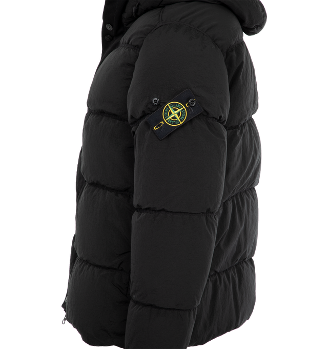 Image 3 of 3 - BLACK - Stone Island Giubbotto Vera Piuma RDS Jacket has a classic hood, 2-way zipper closure, collar, zipper side pockets, and detachable signature Compass badge. Down filled. 84% polyamide, 16% elastane.  