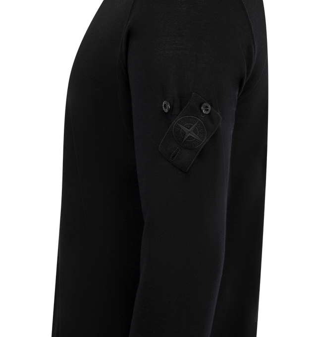 Image 3 of 3 - BLACK - STONE ISLAND Crew Neck featuring thinly ribbed neckline, overlock seams on shoulders and armholes, Stone Island Ghost badge on the left sleeve, ribbed cuffs and bottom band and regular fit. 100% virgin wool. 