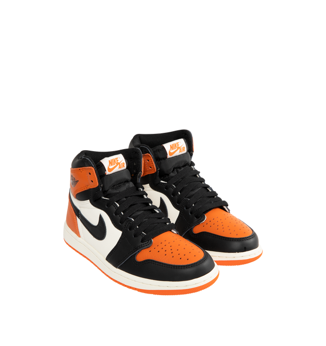 Image 2 of 5 - ORANGE - JORDAN Air Jordan 1 Retro High OG Sneaker featuring encapsulated Air-Sole units, solid rubber outsole, genuine leather, wings logo stamped on collar, stitched-down Swoosh logo, rubber traction and foam sole. 