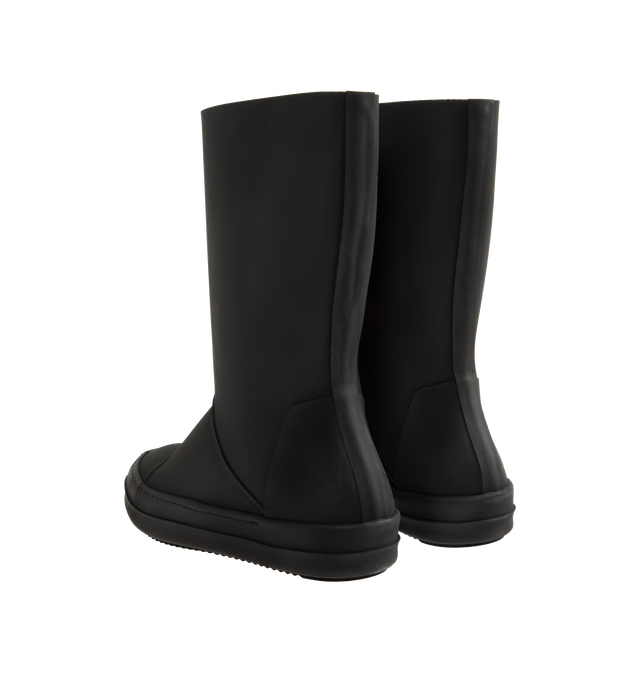 Image 3 of 4 - BLACK - Rick Owens DRKSHDW Sneakwaders are crafted from certified recycled thermoplastic polyurethane and feature a mid-calf silhouette inspired by wader boots. This distinctive design combines a tubular pull-on upper with a classic sneaker-inspired foot, complete with toe caps and signature shark-tooth soles. Developed using certified recycled thermoplastic materials, the construction supports reduced water consumption, emissions, and hazardous waste while lessening reliance on non-renewable 