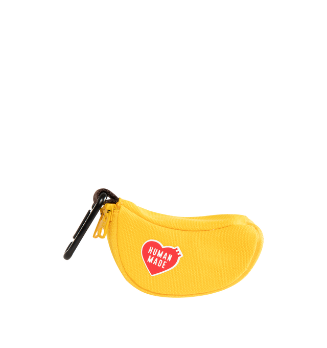 Image 1 of 3 - YELLOW - Human Made Banana Pouch is crafted from thick cotton canvas and features a playful banana-shaped silhouette with a mini carabiner for easy attachment. Designed with a rubber-printed brand logo, a fruit sticker-style heart logo, and a double-zip closure that opens to reveal a banana peel-inspired interior. Main Material: 100% Cotton. Dimensions: 10 cm W x 4.5 cm H x 5 cm D. Fits: AirPods, keys, coins, lip balm, charging cables, and other small essentials.  