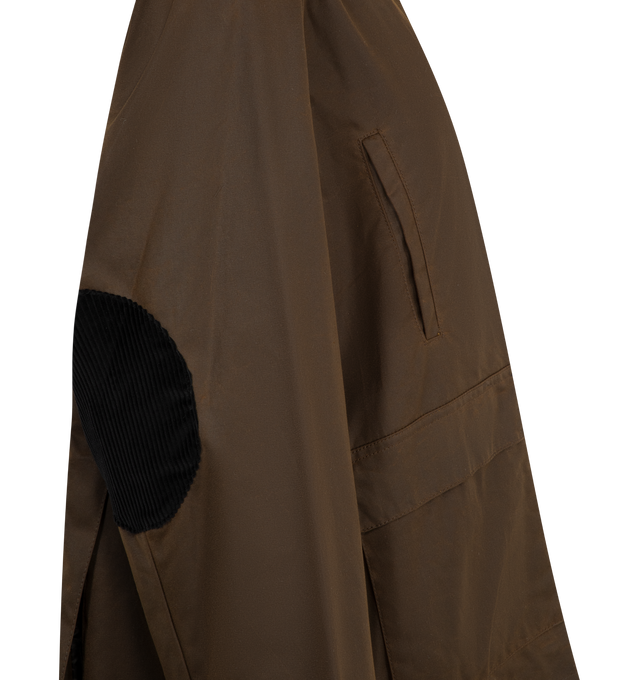 Image 3 of 3 - BROWN - Toteme oversized jacket made from waxed cotton sourced from British heritage weavers and dyed in a new brown shade named bark. It has a very spacious A-line silhouette accented with a black corduroy collar and elbow patches, a zipper and press-stud front, multiple front pockets, and two back vents. 100% cotton organic; lining: 100% viscose; filling: 100% polyester. Made in Romania. 