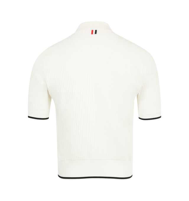 Image 2 of 2 - WHITE - Thom Browne Men's Polo Shirt Inspired by East Coast preppy icons featuring a partial front button placket, buttoned side vents with signature grosgrain trim and signature striped grosgrain loop tab. 100% Cotton. Made in Italy. 