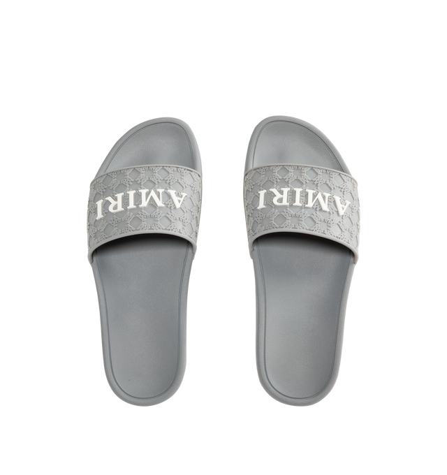 Image 4 of 4 - GREY - AMIRI MA Quad Pool Slides featuring rubber pool slides, logo pattern embossed throughout, open toe, logo embossed at vamp and outer side, molded rubber footbed and treaded rubber sole. Rubber.  