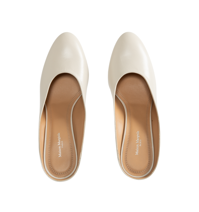 Image 4 of 4 - WHITE - Maison Margiela Women's Plexi Pump Mules are crafted from white calf leather with a soft, polished finish. The slip-on silhouette features a rounded toe, open back, sculpted transparent wedge heel, and the Maison's signature single white stitch at the back. Upper: 100% Calf Leather. Lining: 100% Ovine Leather. Contrast: 100% Calf Leather. Sole: 100% Calf Leather. Made in Italy. 