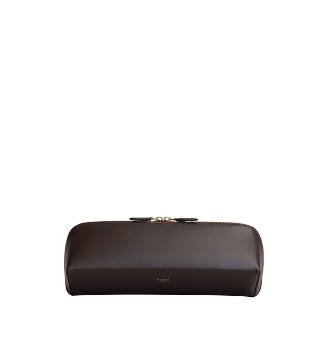 Image 1 of 2 - BROWN - Alaa Women's Delta Clutch is crafted from soft black box calfskin and features a sculptural elongated shape with square lines and a double-zip closure. Designed for hand carry, it fits a large phone, card case, and keys. Main Material: 100% Calf Leather. Main Lining: 100% Calf Leather. Dimensions: 31 x 12 x 9 cm / 12.2 x 4.7 x 3.5 in. Made in Italy. 
