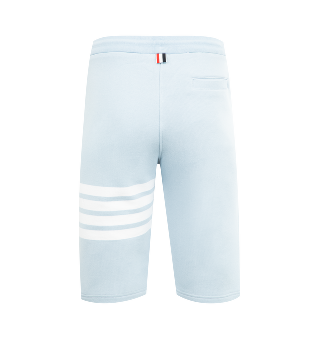 Image 2 of 3 - BLUE - THOM BROWNE Classic Loopback 4-Bar Sweatshorts featuring drawstring waistband with silver tone aglets, engineered 4-bar stripe detail at left thigh, name tag applique above left cuff, slip side pockets, single back welt pocket and signature striped grosgrain loop tab at back waist. 100% cotton. Made in Japan. 