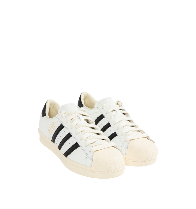 Image 2 of 5 - WHITE - ADIDAS Superstar Vintage Sneaker featuring shell toe, 3-Stripes and heel tab, a leather upper, lining and insole all sits atop a classic rubber cupsole, regular fit, lace closure and rubber outsole. 