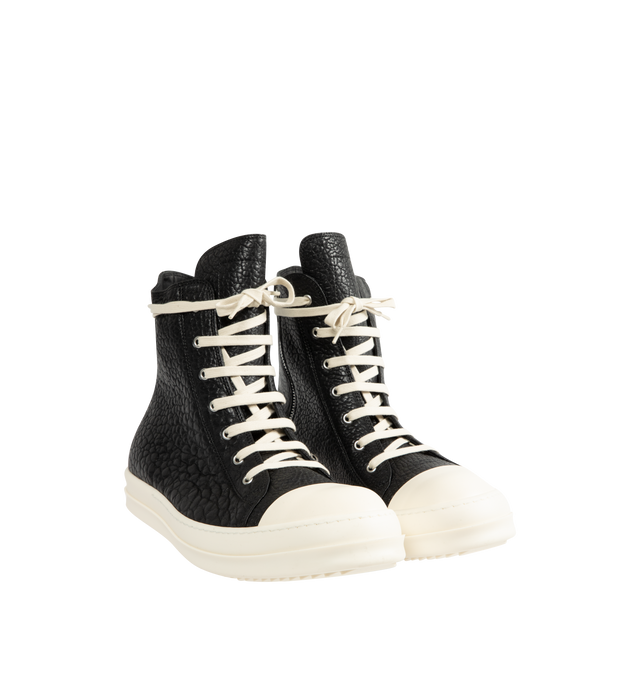 Image 2 of 5 - BLACK - Rick Owens Mens High-Top Sneakers feature a pebbled lamb leather and full-grain calf leather upper. Designed with a high-top silhouette, cream rope laces, off-white rubber toe cap, chunky ridged rubber cupsole, and lace-up closure. Upper: Lamb Leather and Calf Leather; Outsole: Rubber. Made in Italy. 