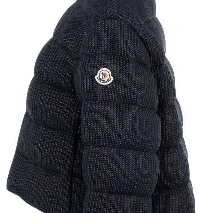 Image 3 of 3 - NAVY - Moncler Thoiry Sparkly Down Puffer Jacket has a stand collar, a 2-way zip front, a classic fit, and an embroidered logo patch. Lined. Down and feather fill. Made in Romania.  