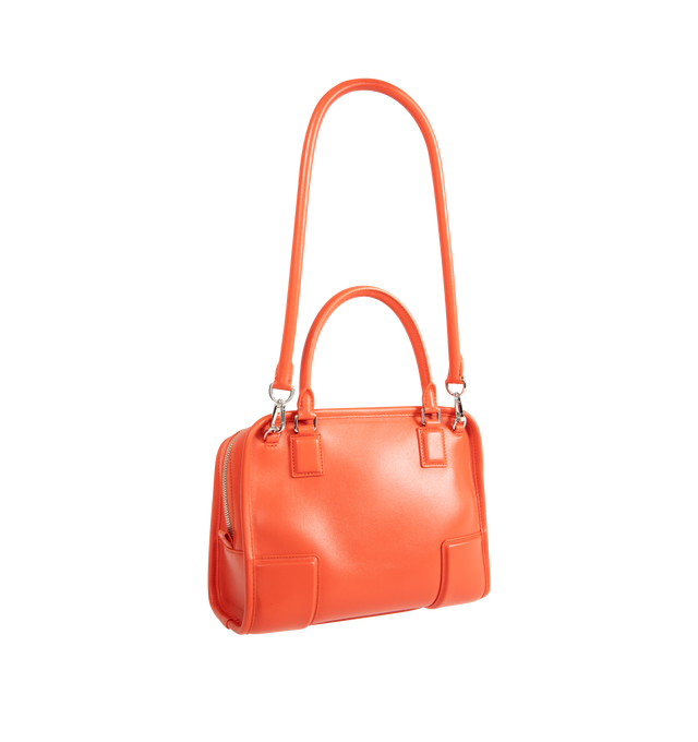 Image 3 of 4 - ORANGE - Loewe Small Amazona 180 Bag in leather features a relaxed silhouette anchored by a single toron top handle, designed to be carried open, while a concealed closure secures the main compartment, three carry options: short handle, removable shoulder strap and crossbody, zip closure with two leather zip pullers, two compartments, main compartment closed with magnetic closure, internal flat pocket, left side d-ring for customization, nappa lambskin lining, and embossed double L branding.  