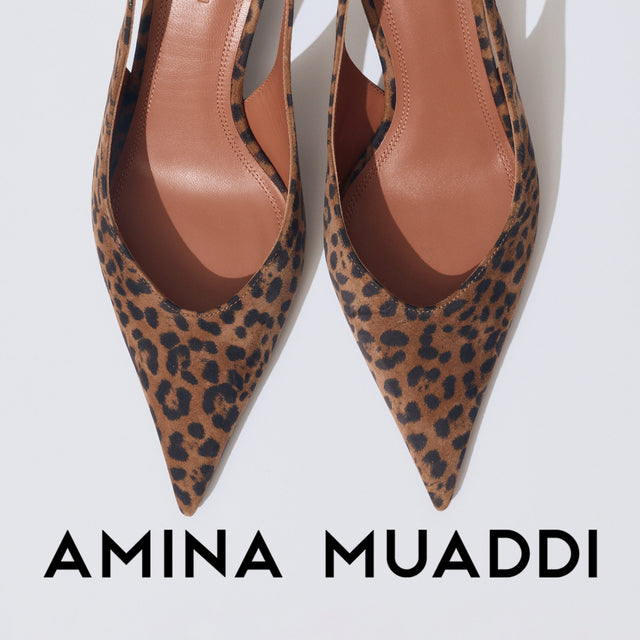 Leopard print high heels with 'Amina Muaddi' branding on a white background 
