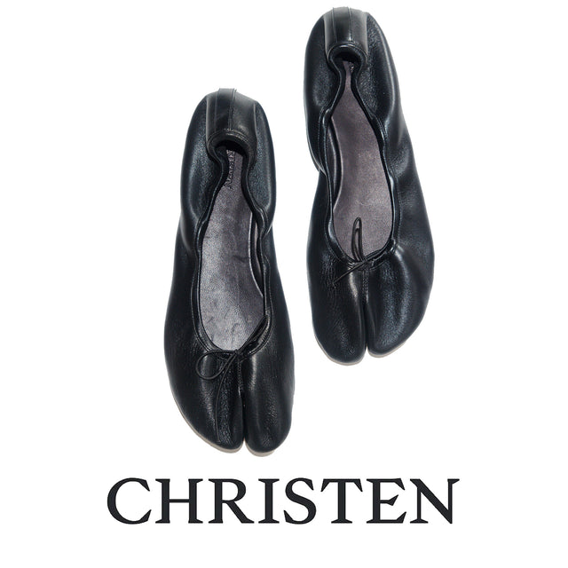 A pair of black leather Christen toe-separated ballet flats shown from a top-down view on a white background with the brand name 'CHRISTEN' printed below. 