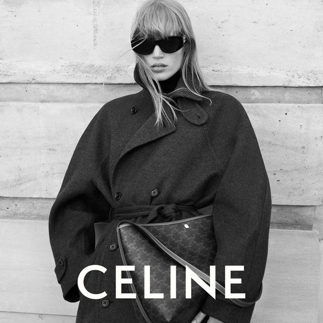 Person wearing a dark coat and sunglasses with 'Celine' branding. 
