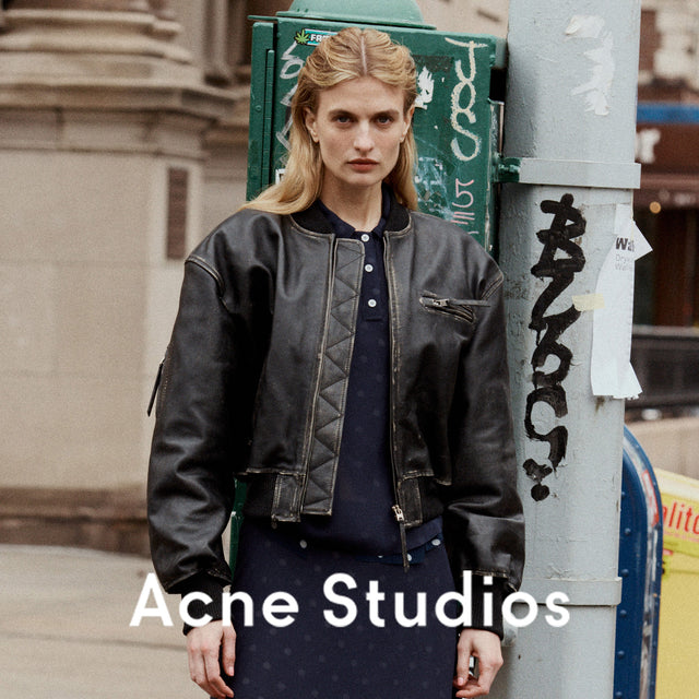 woman wearing black leather bomber jacket by Acne Studios 