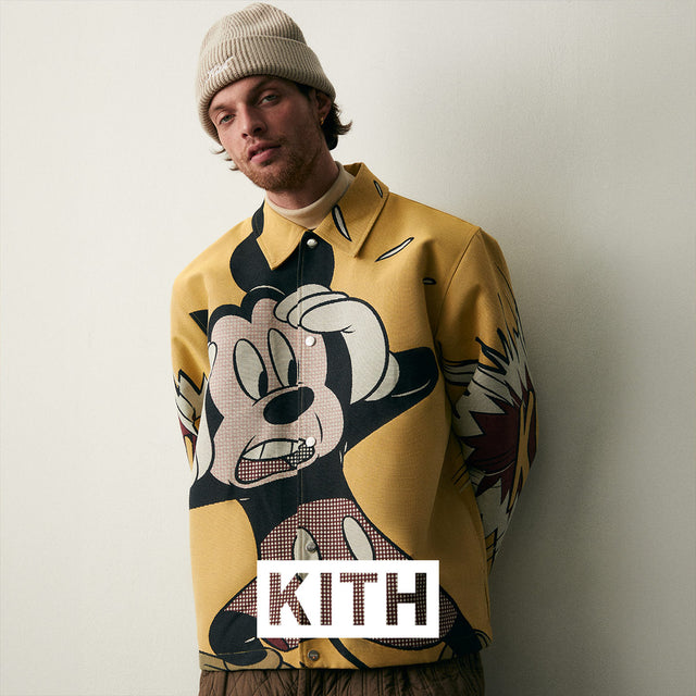 Man wearing Kith X Disney sweatshirt and beanie, KITH logo. This brand is available in-store only, not available for purchase online.