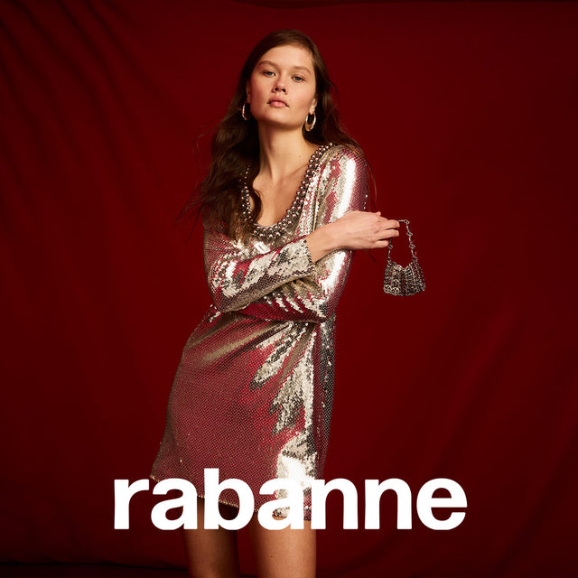 Woman wearing silver sequin mini dress with long sleeves by Rabanne