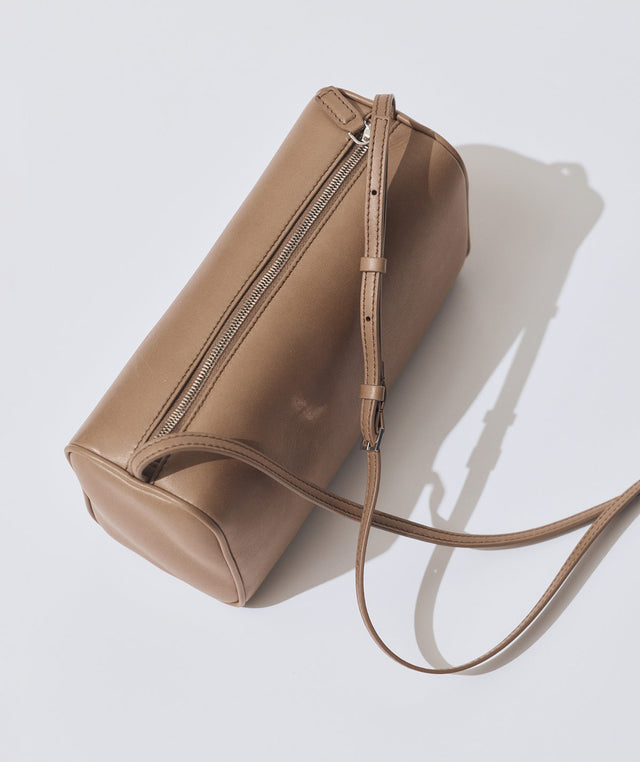 Brown leather handbag with a strap by The Row 