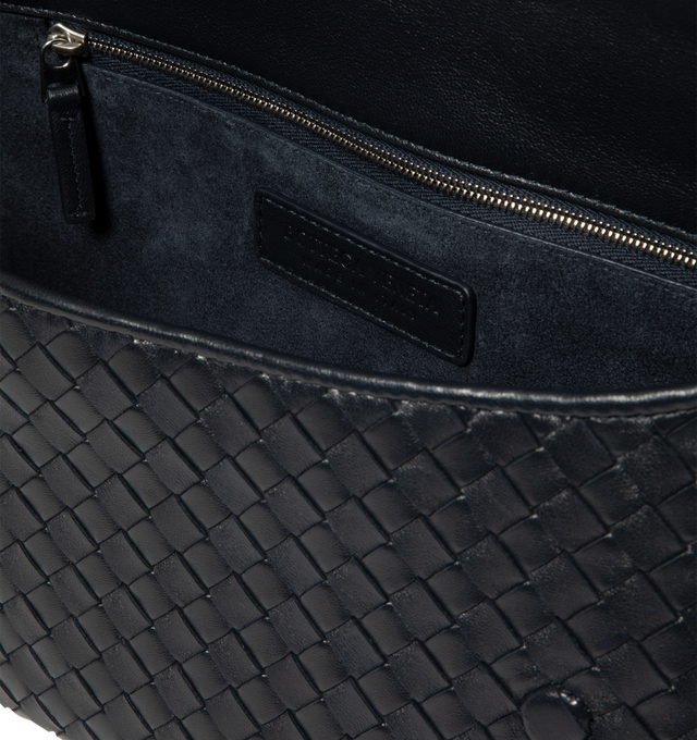 Image 3 of 3 - BLACK - Bottega Veneta Mens Veneto Messenger Bag is crafted from soft Intrecciato nappa leather. Features a rounded silhouette with flap closure, one interior zip pocket, one open pocket, suede lining, and silver-finish hardware. Main Material: Nappa Leather; Lining: Suede. Dimensions: 18.5 cm H x 26 cm W x 5 cm D (7.3" H x 10.2" W x 2"). Strap drop: 52 cm (20.5"). Made in Italy. 
