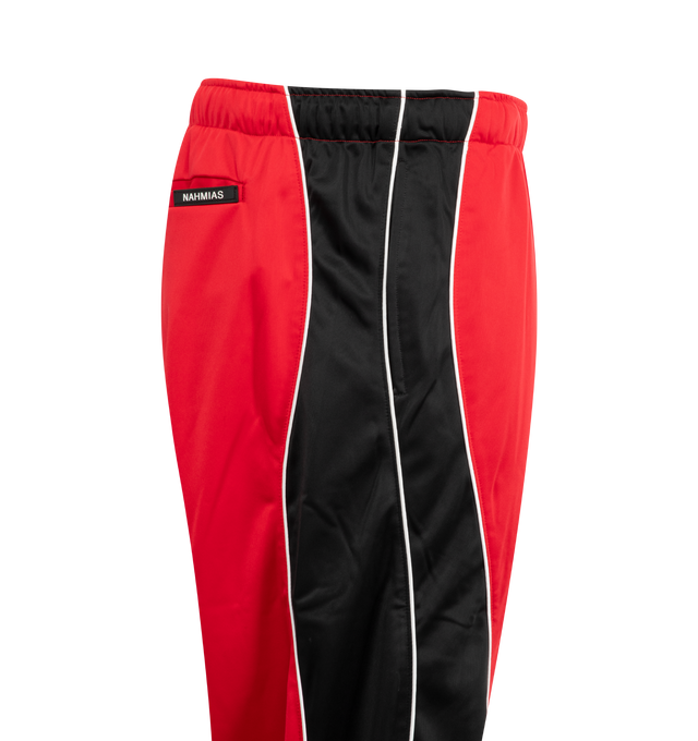 Image 3 of 3 - RED - NAHMIAS Ollie Sweatpants featuring relaxed fit, elasticated waistband, side pockets, embroidered logo and drawstring closure. 100% nylon. 
