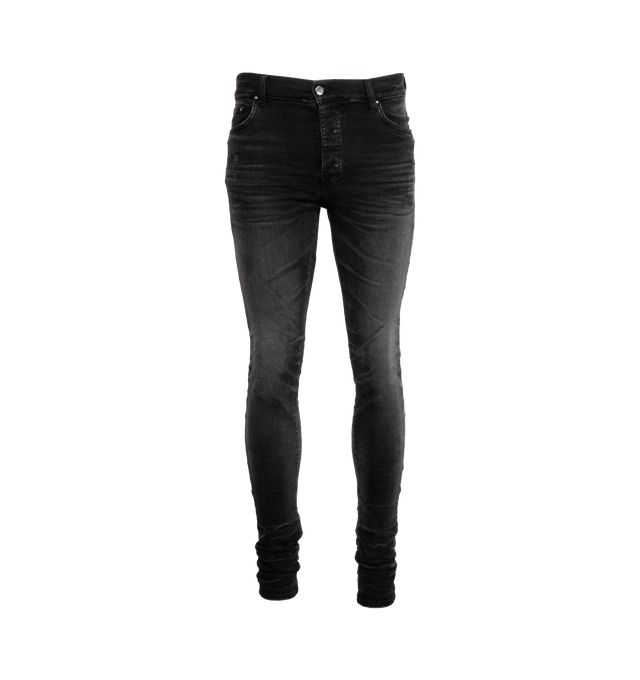 BLACK - AMIRI Stack whiskered skinny jeans made from stretch-cotton denim featuring whiskering effect at the thighs, logo patch to the rear, belt loops, button fly fastening, and classic five pockets. Made in United States. Cotton 92%, Elastomultiester 6%, Elastane 2%.