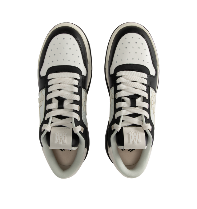 Image 5 of 5 - BLACK - Amiri Men's Classic Low Sneaker is a lace-up style crafted on a rubber sole with leather upper and central panels of molded rubber mesh framing the AMIRI staggered logo. Made in Vietnam. Upper: Leather. Sole: Rubber. 