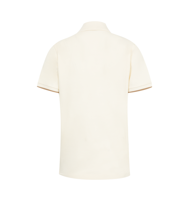 Image 2 of 2 - WHITE - MONCLER Polo shirt has a spread collar, snap button placket, embroidered logo at chest and contrast stripe trim. 100% cotton.  