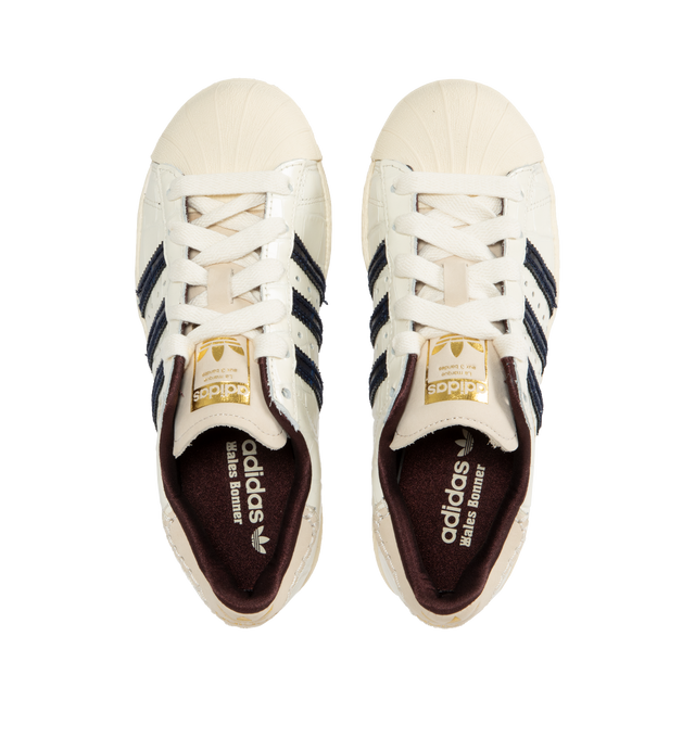 Image 5 of 5 - WHITE - Adidas X Wales Bonner Superstar Sneakers are a lace-up style with croc-embossed leather, signature strips, and rubber soles. 