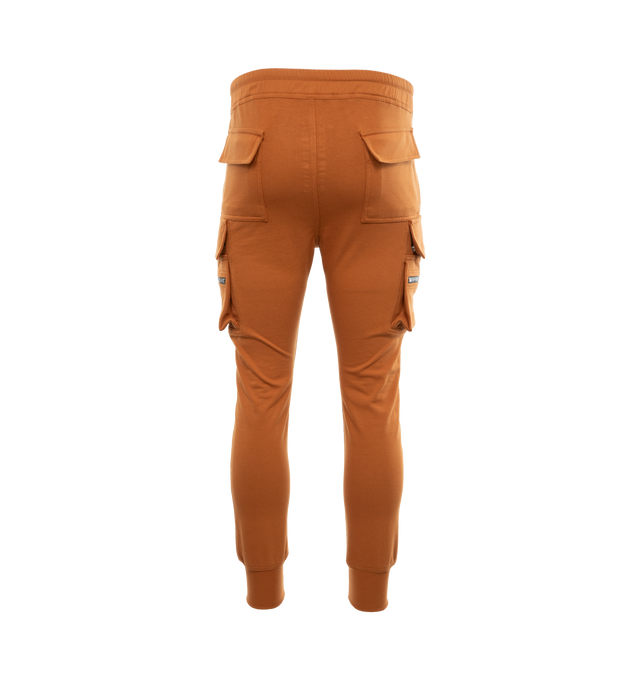 Image 2 of 3 - BROWN - RICK OWENS Mastodon Cargo Sweatpants featuring elasticated drawstring waist, tapered leg, side slit pockets, back pockets and zipped pockets. 100% cotton. 